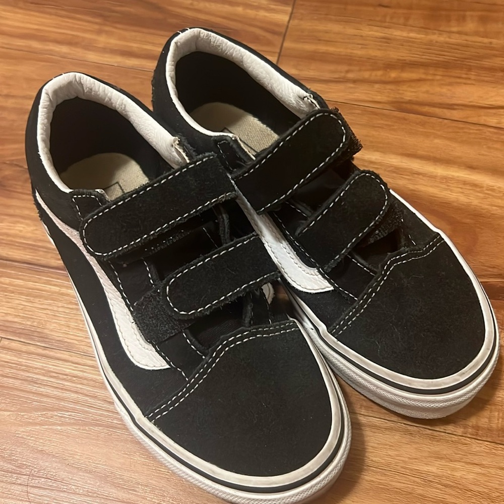 Kids size 13.5 old school vans. Not new but semi new.